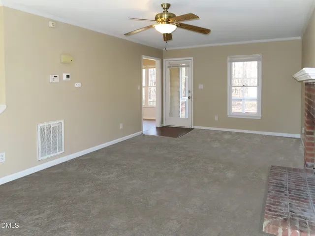 a view of an empty room with a window