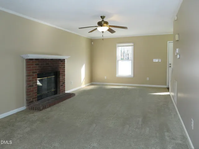 a view of livingroom with window fireplace