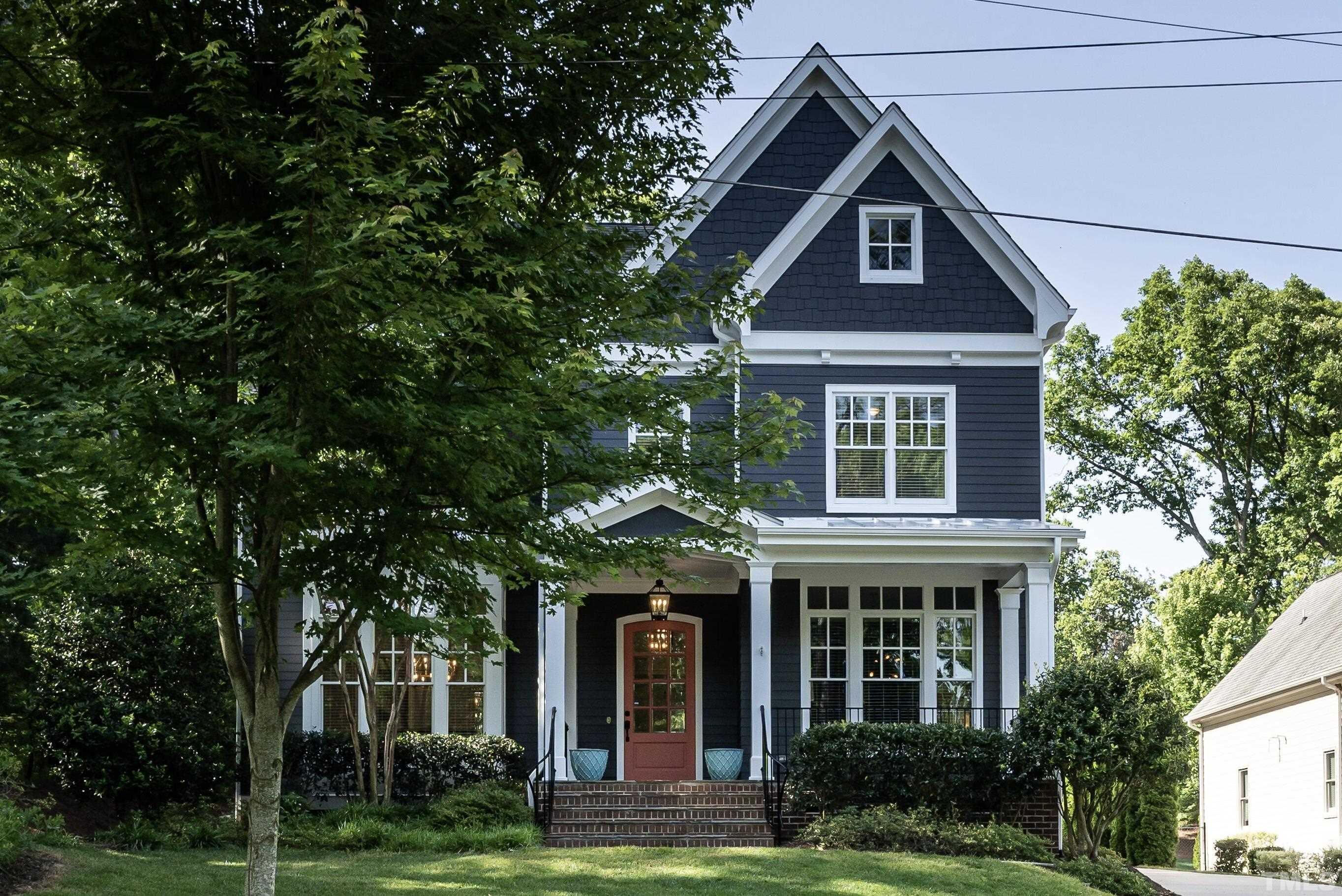 3403 Ocotea Street Raleigh, NC 27607 - Photo 1 of 46 a front view of a house with garden