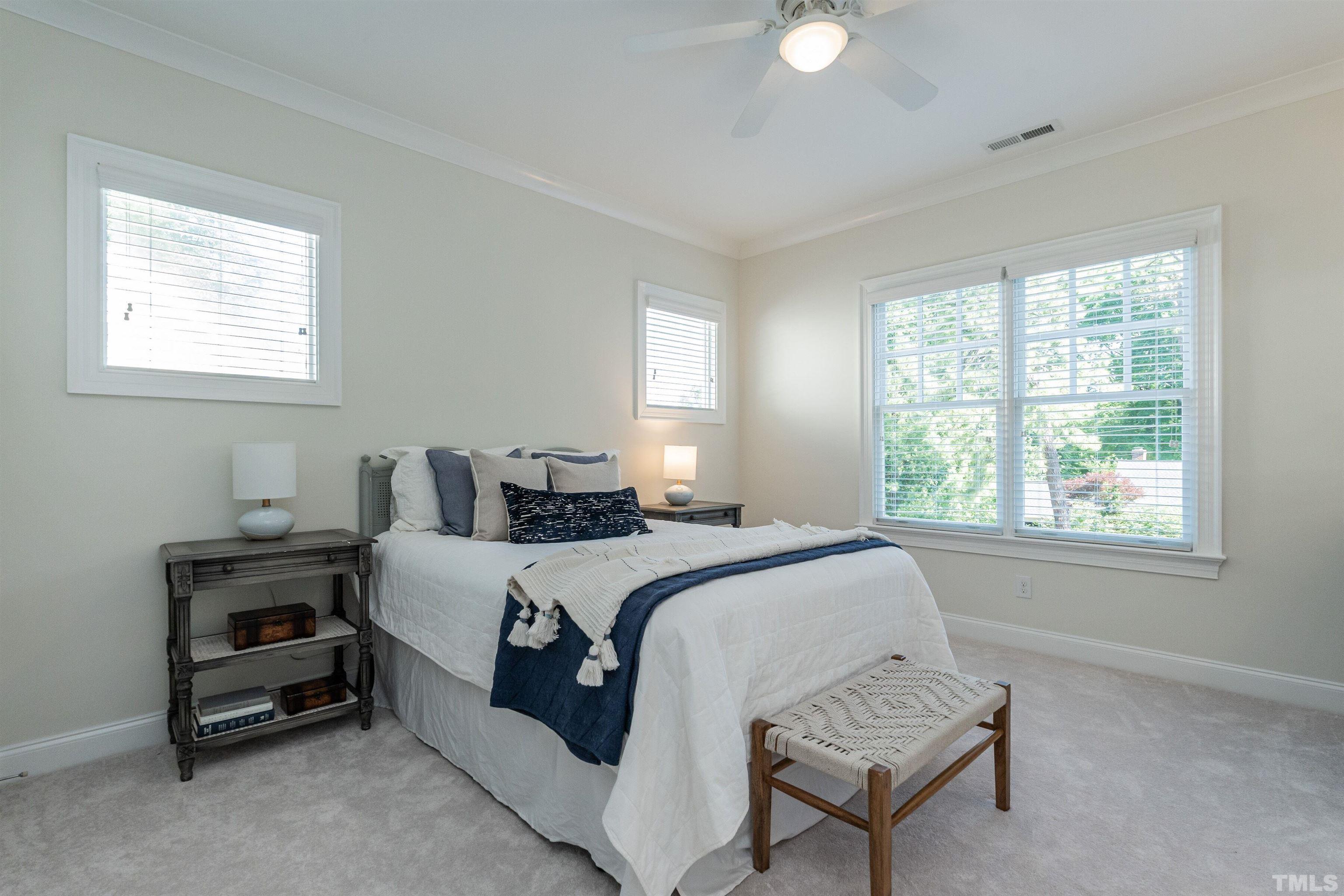 3403 Ocotea Street Raleigh, NC 27607 - Photo 22 of 46 a bed room with a bed and a chair