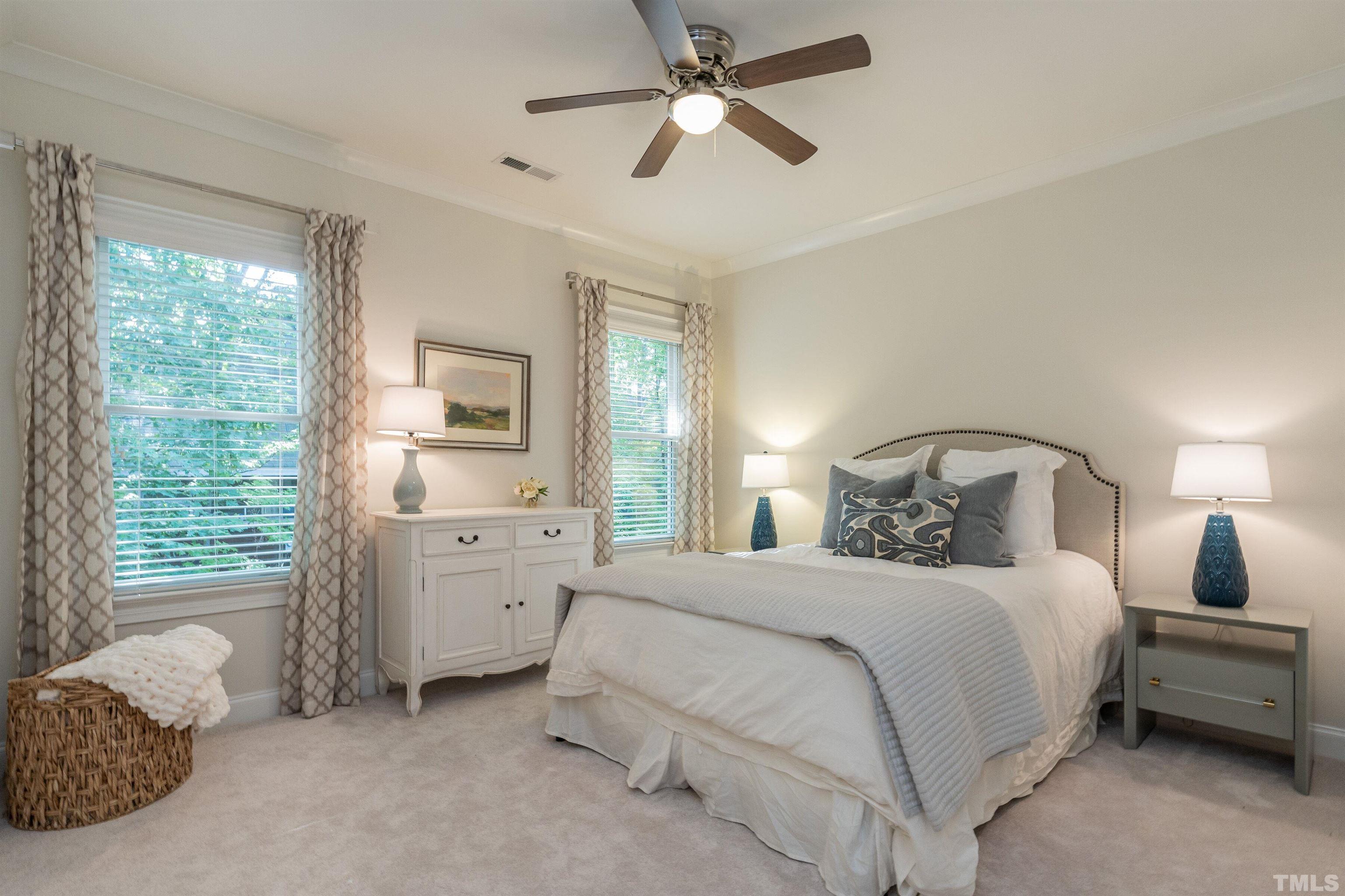 3403 Ocotea Street Raleigh, NC 27607 - Photo 26 of 46 a bedroom with a bed and a chandelier fan