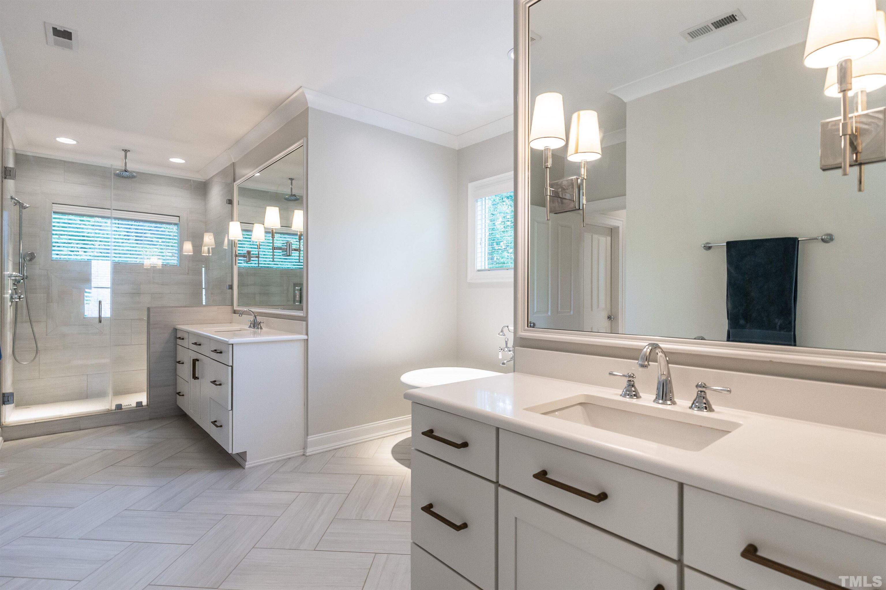 3403 Ocotea Street Raleigh, NC 27607 - Photo 34 of 46 a bathroom with a sink double vanity and a mirror