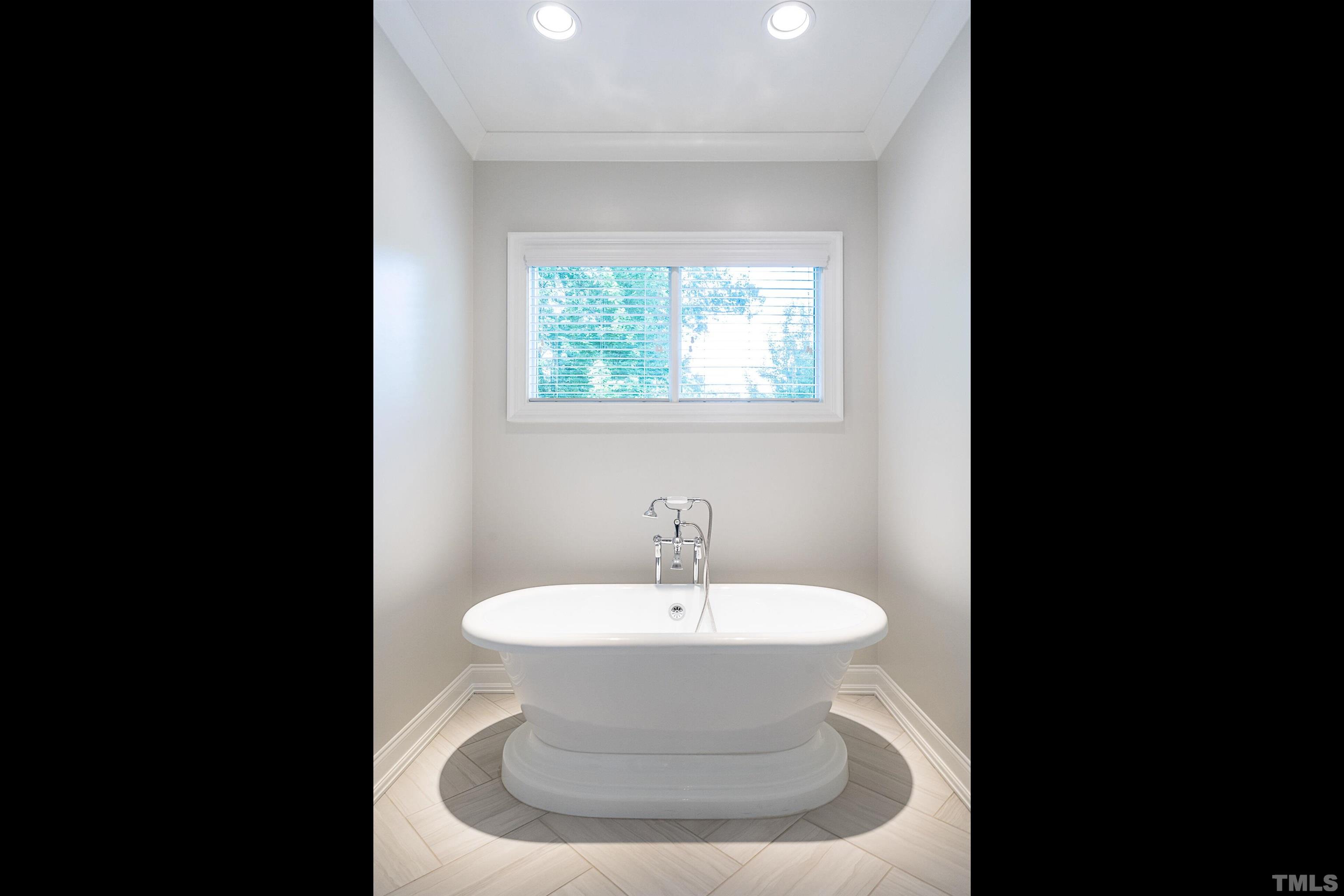3403 Ocotea Street Raleigh, NC 27607 - Photo 35 of 46 a bathroom with a sink and a mirror