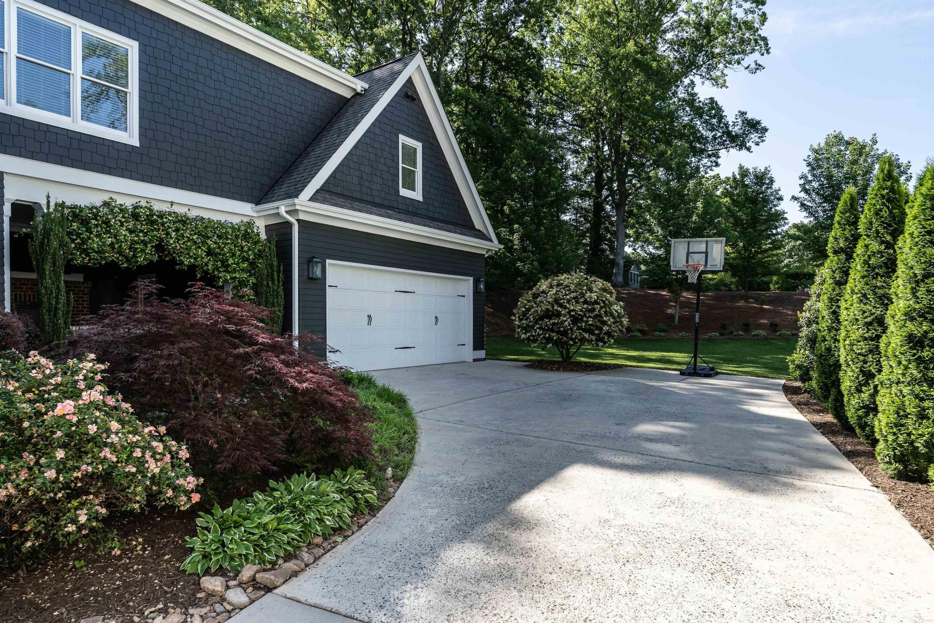 3403 Ocotea Street Raleigh, NC 27607 - Photo 40 of 46 a front view of a house with a yard and garage