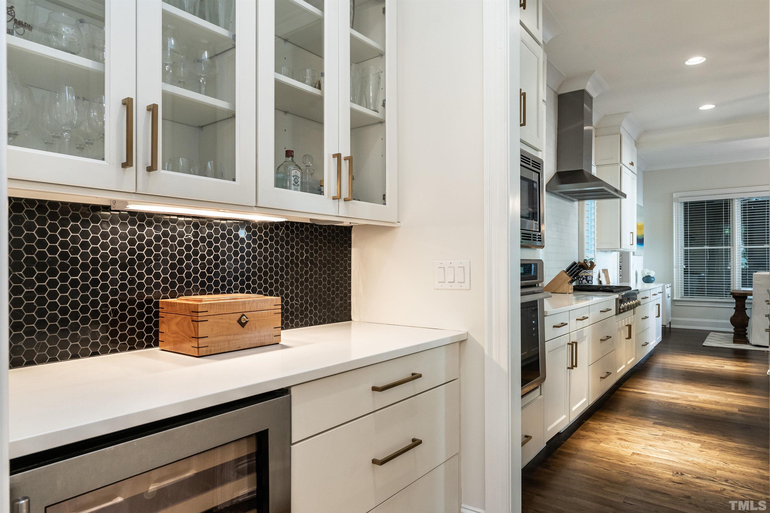 3403 Ocotea Street Raleigh, NC 27607 - Photo 6 of 46 a kitchen with a sink and cabinets