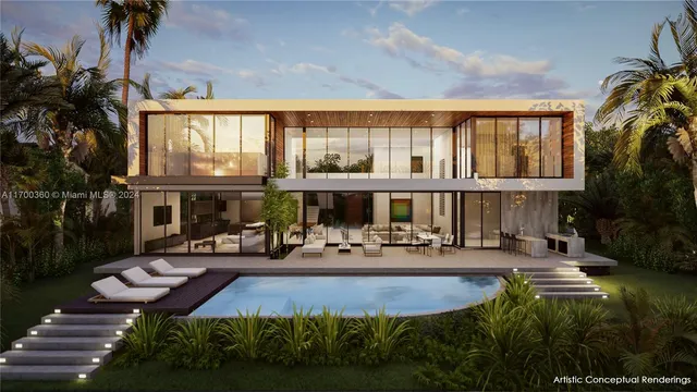 a front view of building with yard and outdoor seating