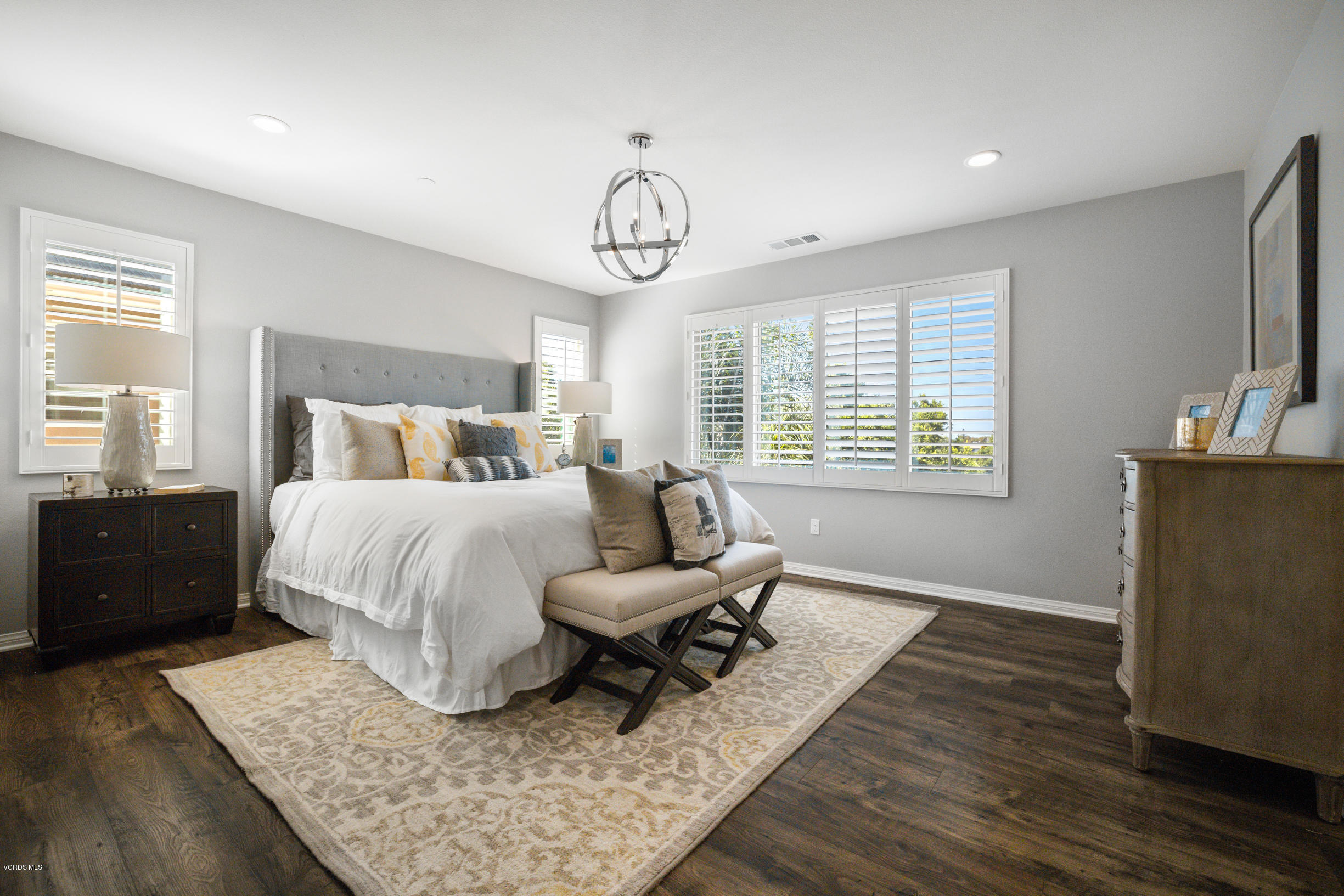 4991 Edenbridge Road Moorpark, CA 93021 - Photo 22 of 30 a bedroom with a bed and wooden floor