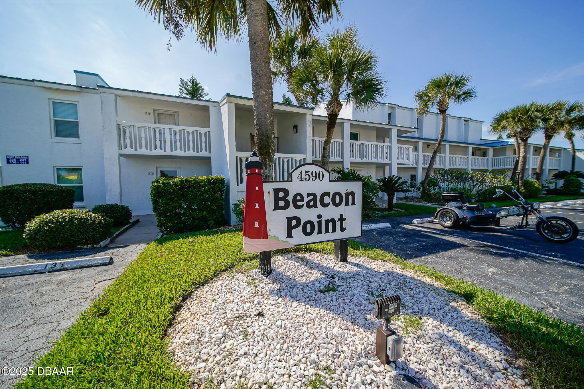 4590 South Atlantic Avenue, Unit 247 Ponce Inlet, FL 32127 - Photo 1 of 36 a sign on the side of the building