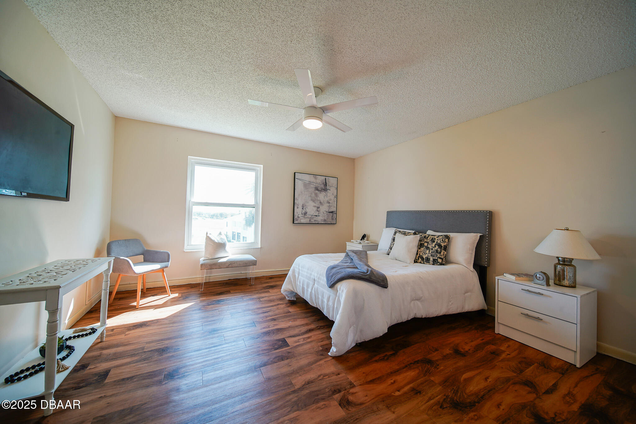 4590 South Atlantic Avenue, Unit 247 Ponce Inlet, FL 32127 - Photo 12 of 36 a bedroom with a bed and a flat screen tv