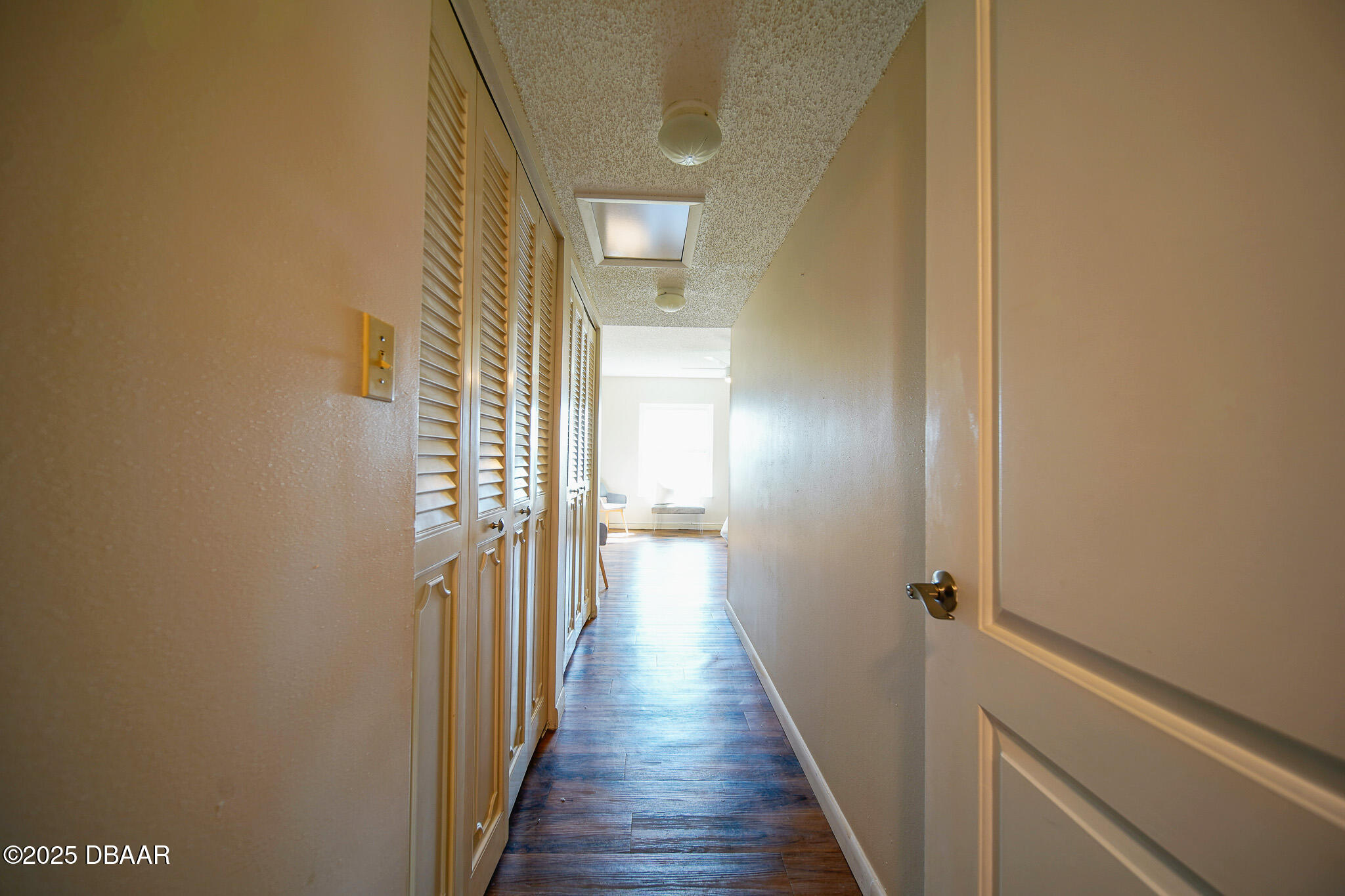 4590 South Atlantic Avenue, Unit 247 Ponce Inlet, FL 32127 - Photo 13 of 36 a view of a hallway with wooden floor