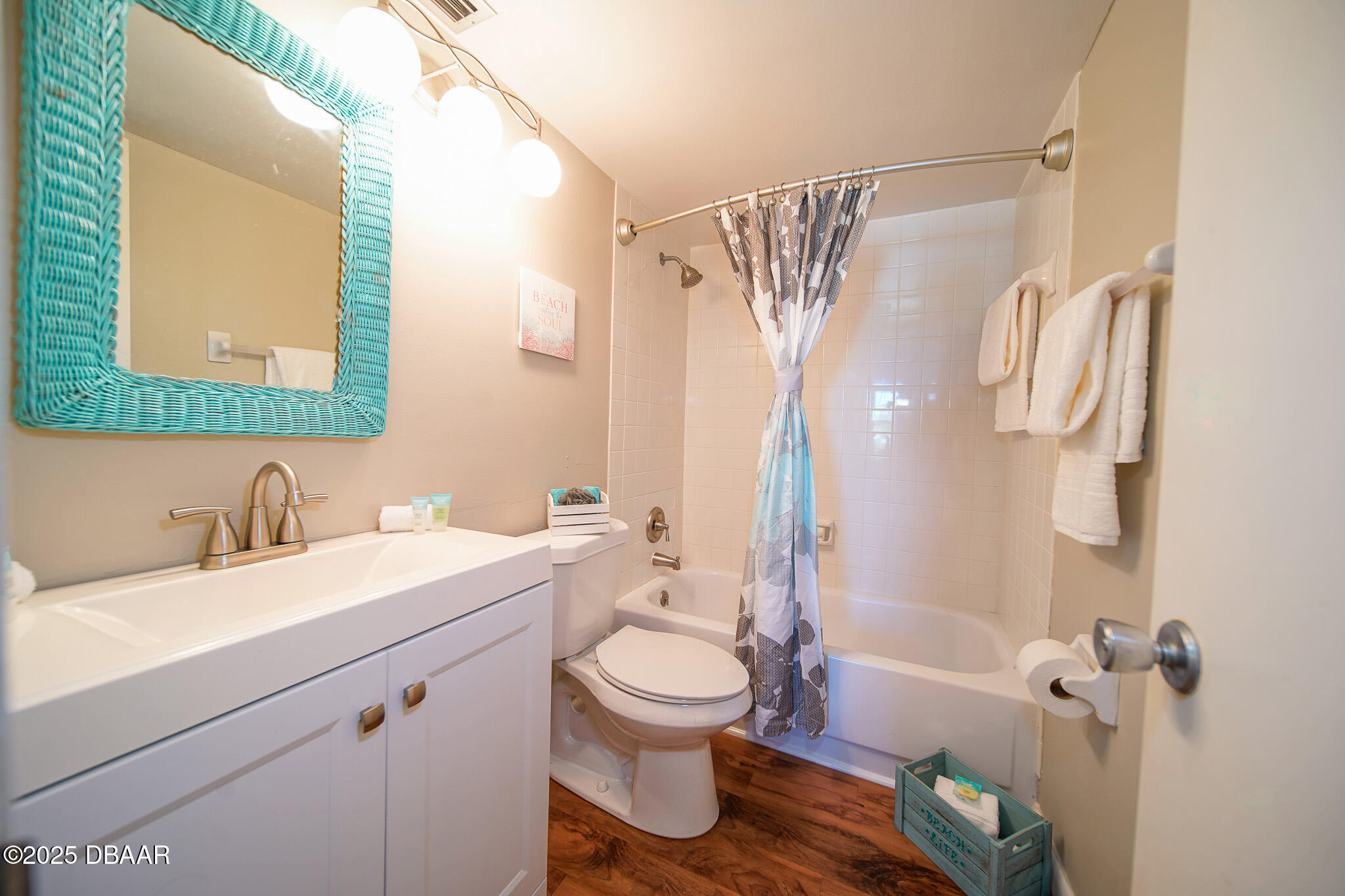 4590 South Atlantic Avenue, Unit 247 Ponce Inlet, FL 32127 - Photo 15 of 36 a bathroom with a sink a toilet and a mirror