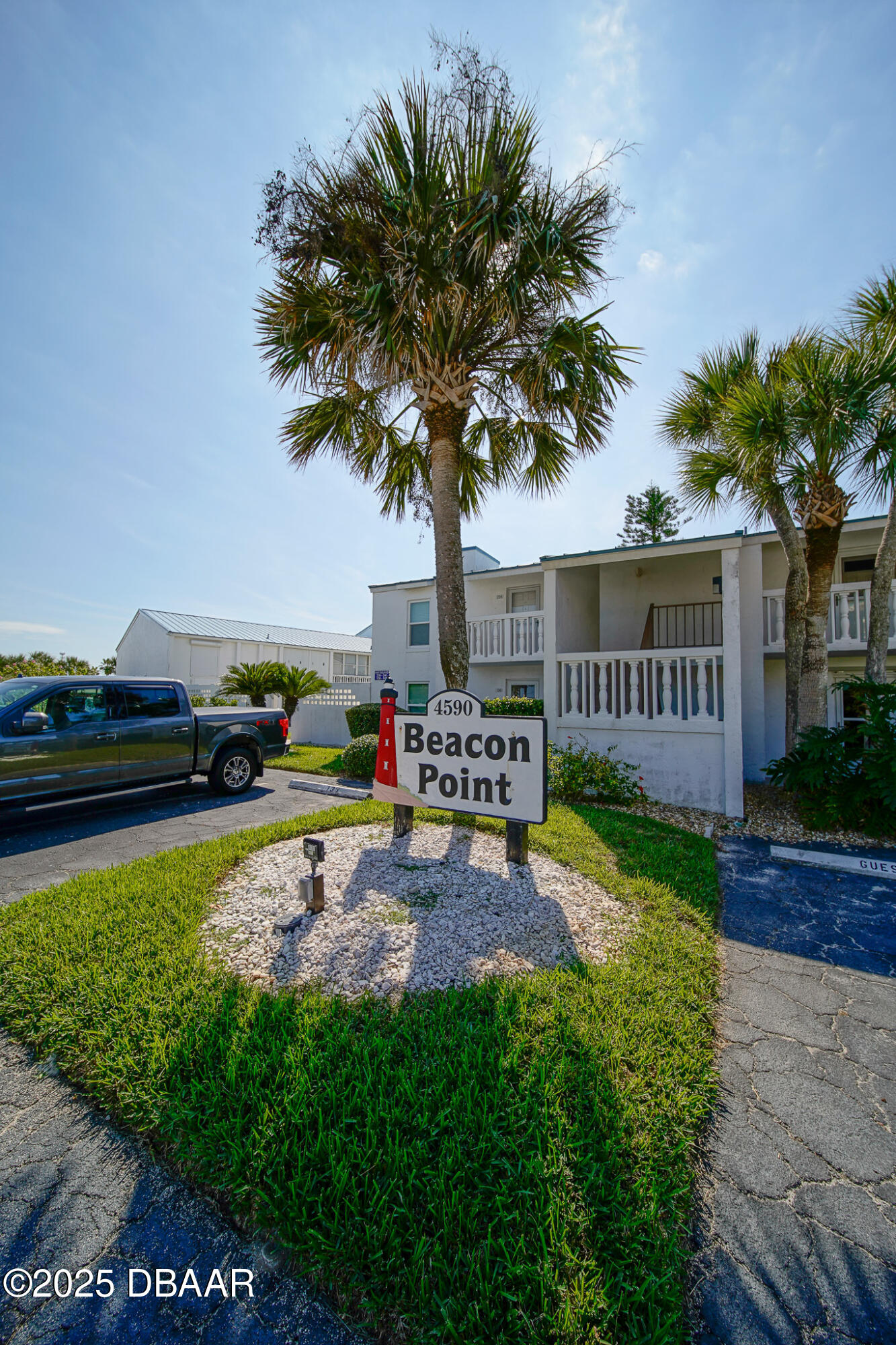 4590 South Atlantic Avenue, Unit 247 Ponce Inlet, FL 32127 - Photo 27 of 36 a view of a garden with a slide