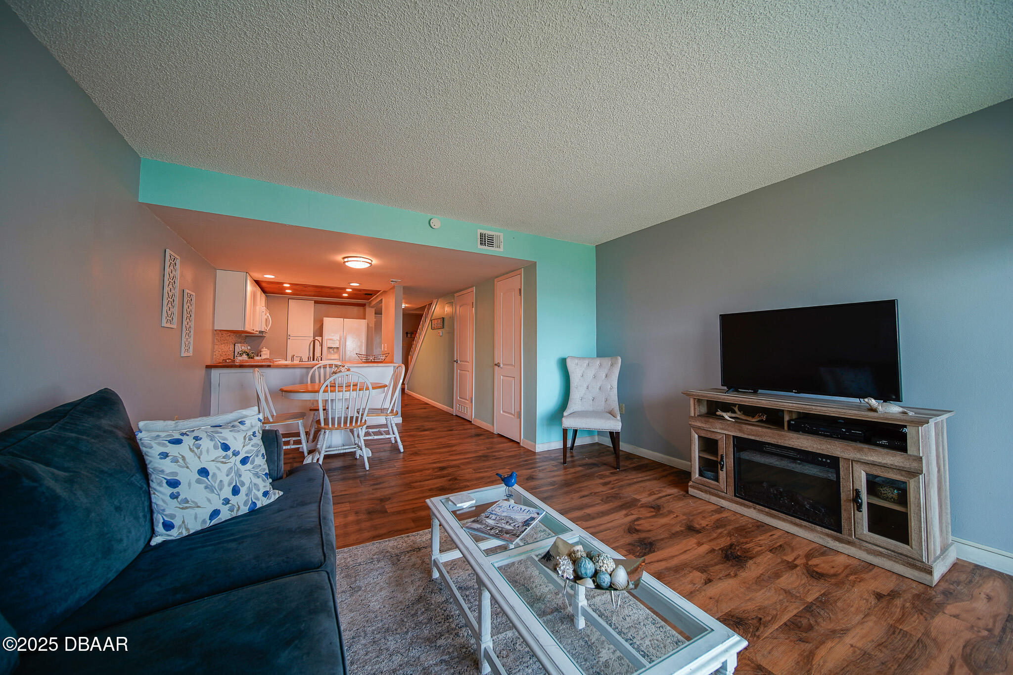 4590 South Atlantic Avenue, Unit 247 Ponce Inlet, FL 32127 - Photo 8 of 36 a living room with furniture and a flat screen tv