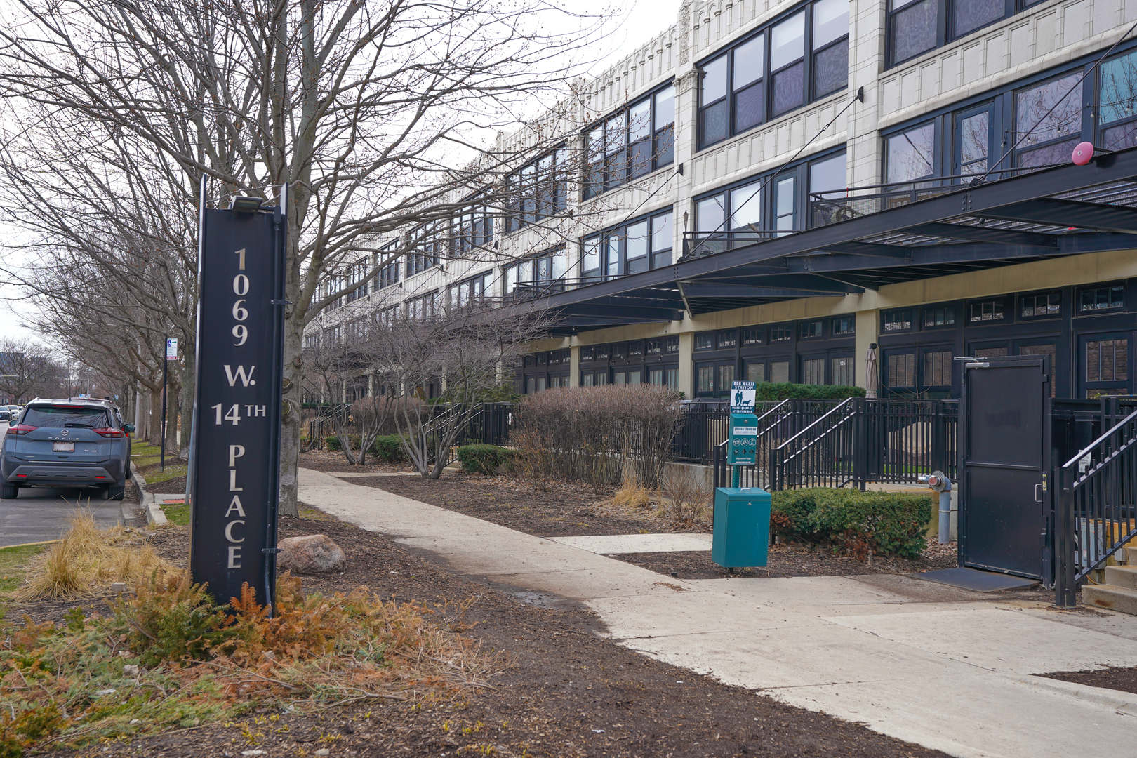 1069 West 14th Place, Unit 303 Chicago, IL 60608 - Photo 1 of 26 a front view of a building with street view