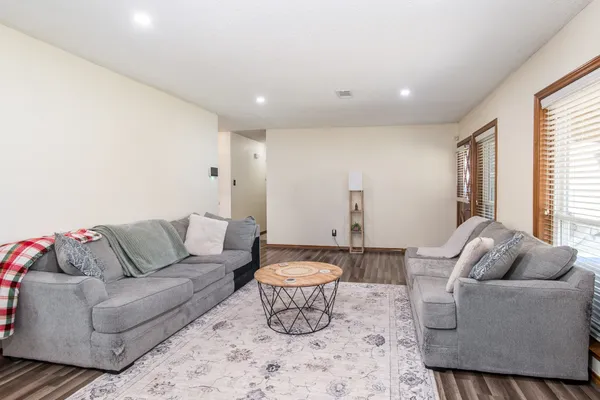 a living room with furniture and a large window