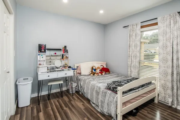 a bedroom with a bed and a table in it