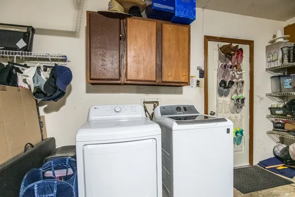 a view of storage and utility room with washer and dryer