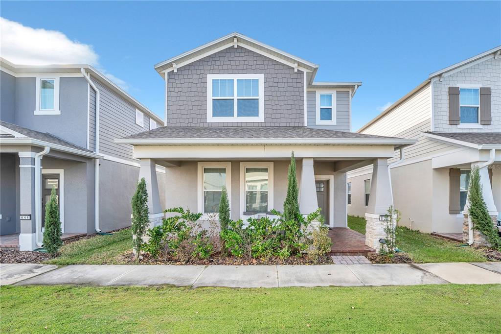 a front view of a house with a yard