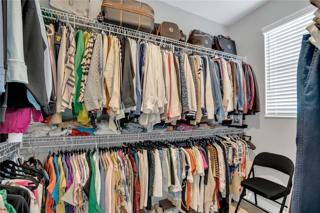 635 Cheval Lane DeBary, FL 32713 - Photo 16 of 33 a view of walk in closet with clothes and shoes
