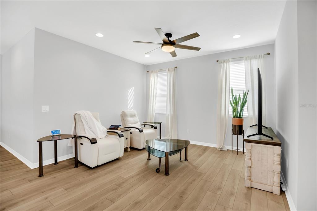 635 Cheval Lane DeBary, FL 32713 - Photo 19 of 33 a living room with furniture and a wooden floor