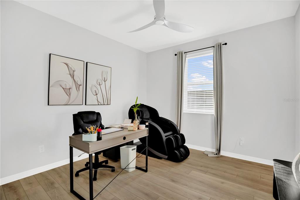 635 Cheval Lane DeBary, FL 32713 - Photo 21 of 33 a view of a workspace with furniture and a window