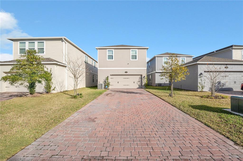 635 Cheval Lane DeBary, FL 32713 - Photo 26 of 33 a front view of a house with garden
