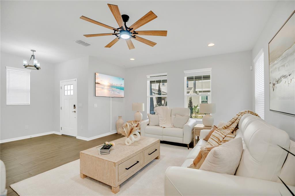 635 Cheval Lane DeBary, FL 32713 - Photo 5 of 33 a living room with furniture and a chandelier