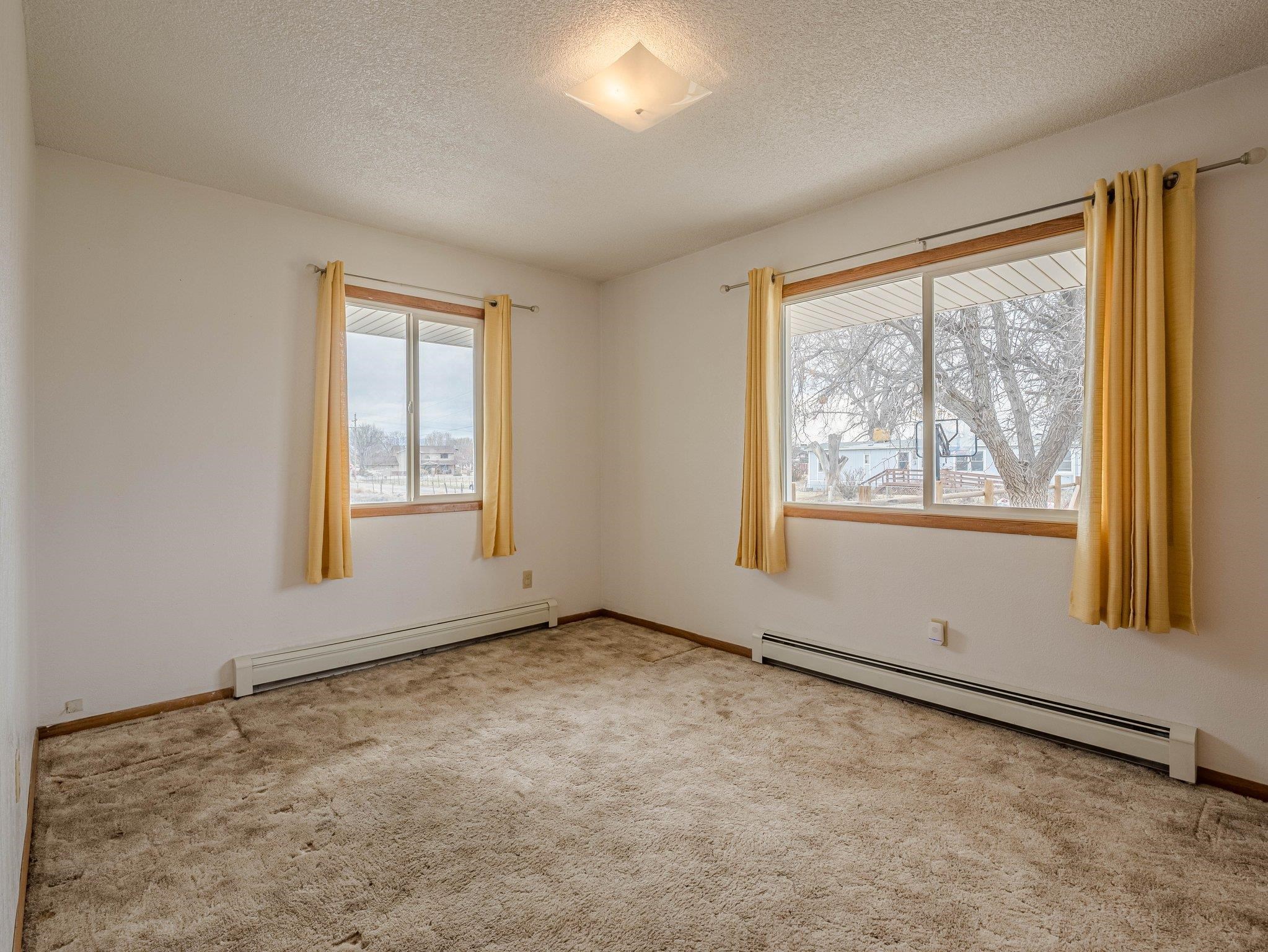 1895 L Road Fruita, CO 81521 - Photo 12 of 29 an empty room with windows