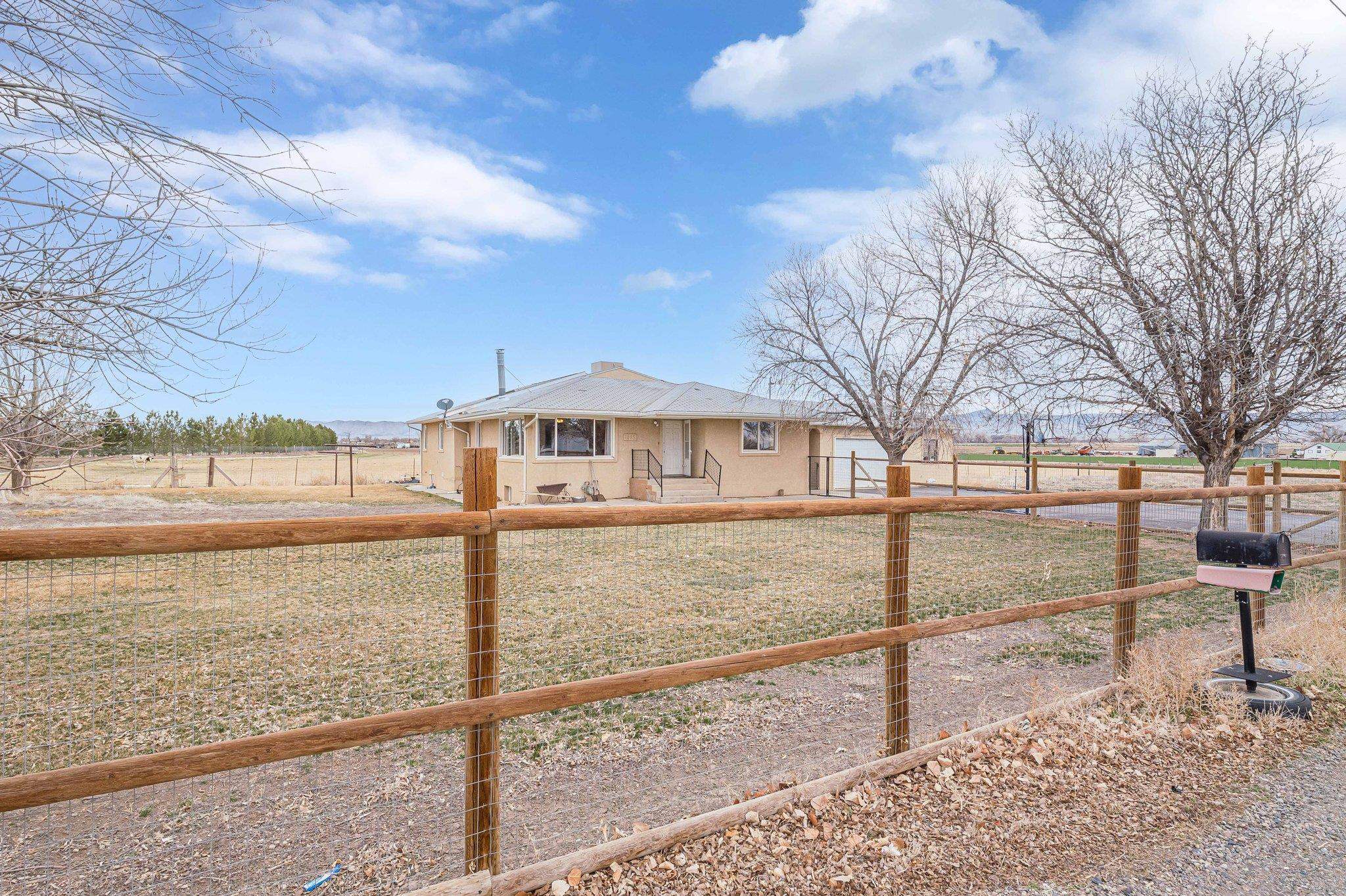 1895 L Road Fruita, CO 81521 - Photo 2 of 29 a view of a yard with wooden fence