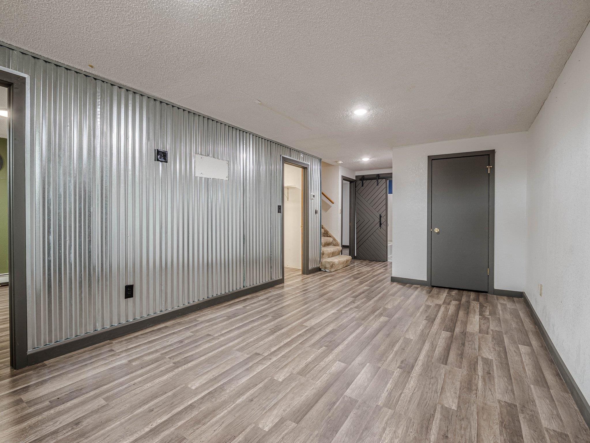 1895 L Road Fruita, CO 81521 - Photo 24 of 29 a view of an empty room with wooden floor and entryway