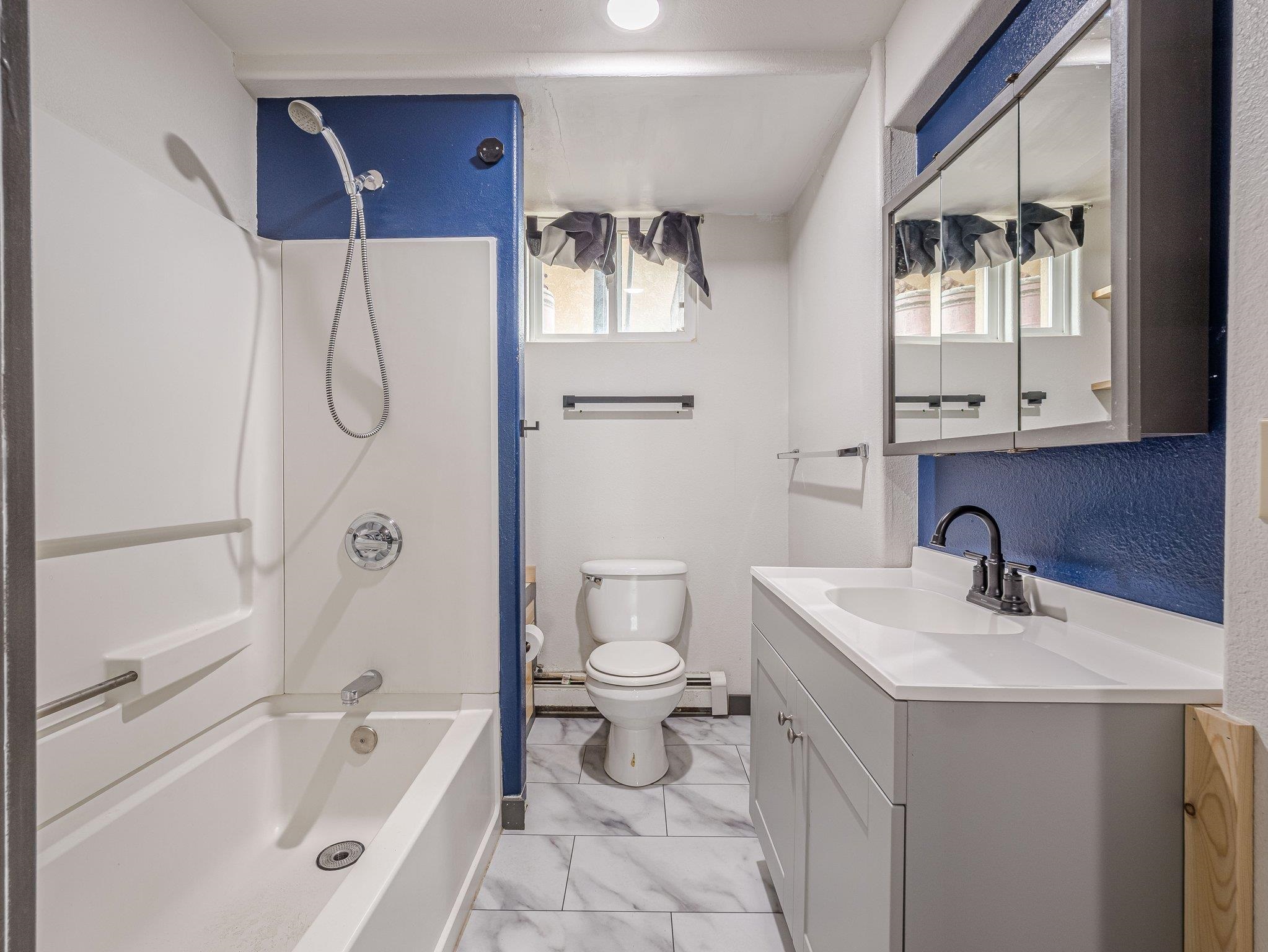 1895 L Road Fruita, CO 81521 - Photo 28 of 29 a bathroom with a bathtub sink mirror and toilet