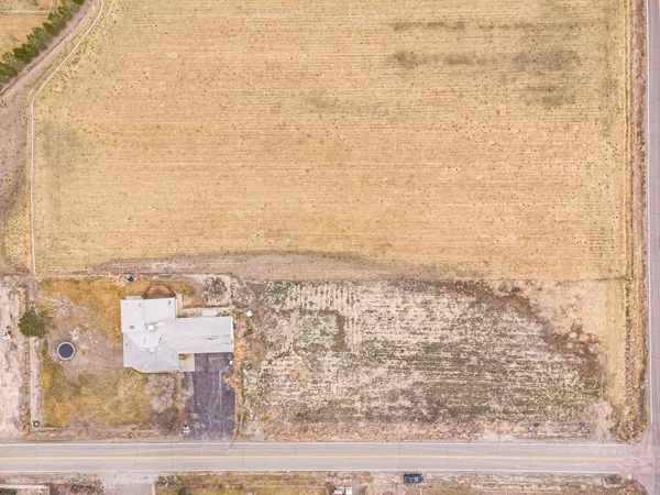 an aerial view of residential building and parking space