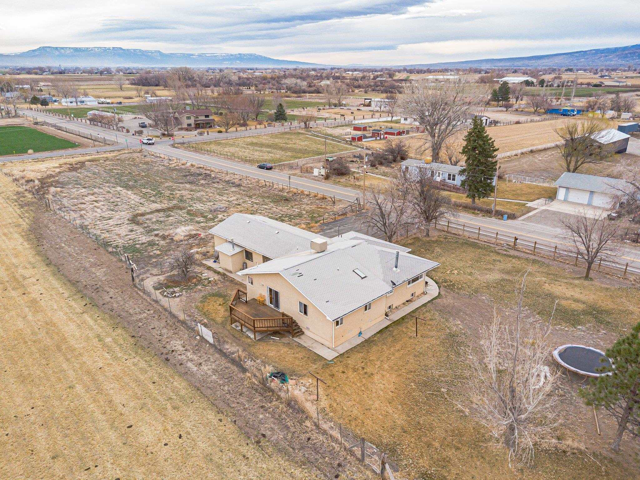 1895 L Road Fruita, CO 81521 - Photo 4 of 29 an aerial view of residential houses with outdoor space