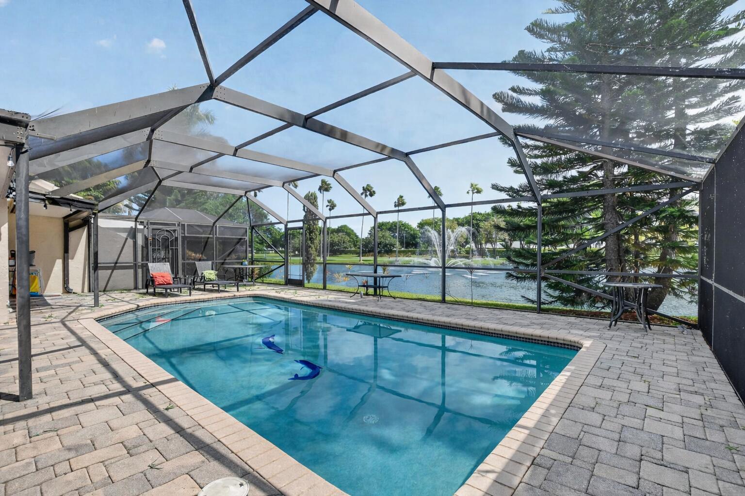 9708 Erica Court Boca Raton, FL 33496 - Photo 13 of 23 Backyard pool with lush landscape