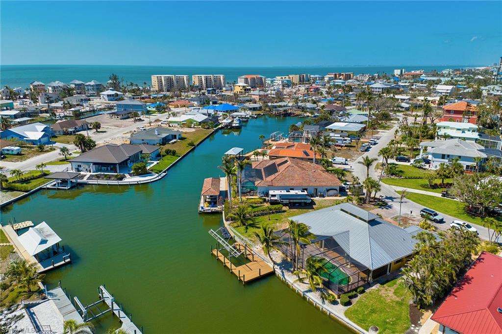 390 Randy Lane Fort Myers Beach, FL 33931 - Photo 1 of 19 an aerial view of a house with a ocean view