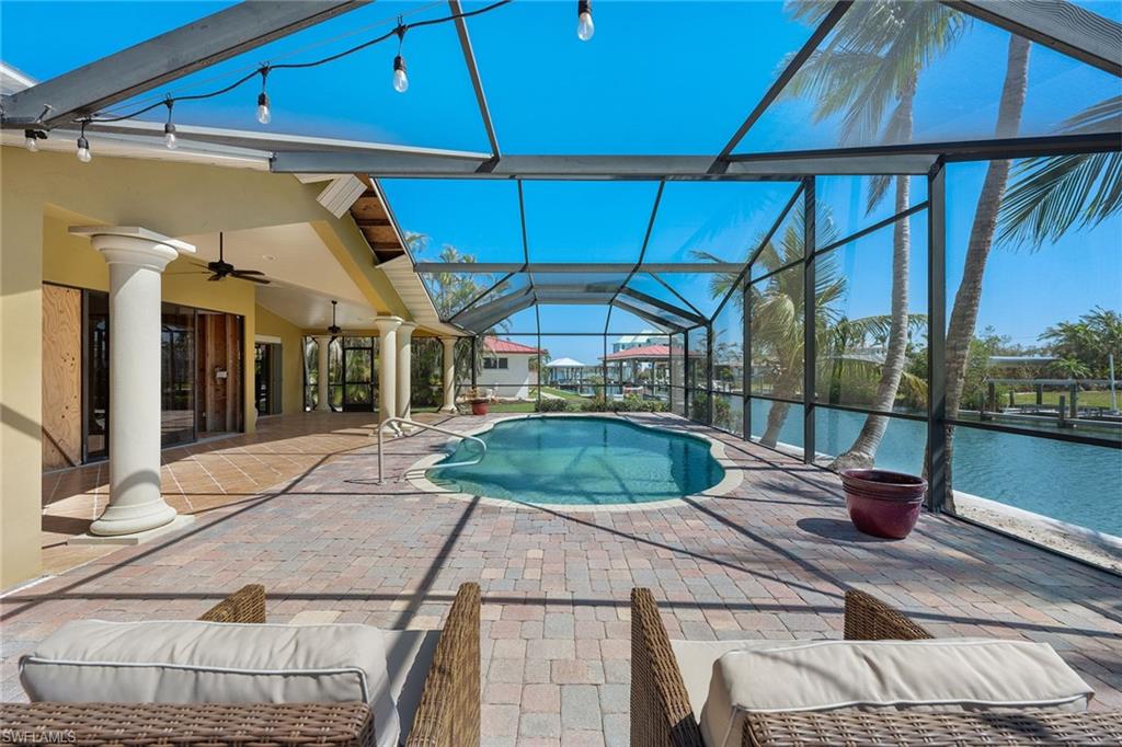 390 Randy Lane Fort Myers Beach, FL 33931 - Photo 16 of 19 a house view with a outdoor space