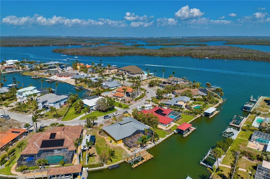 390 Randy Lane Fort Myers Beach, FL 33931 - Photo 19 of 19 an aerial view of ocean and residential houses with outdoor space