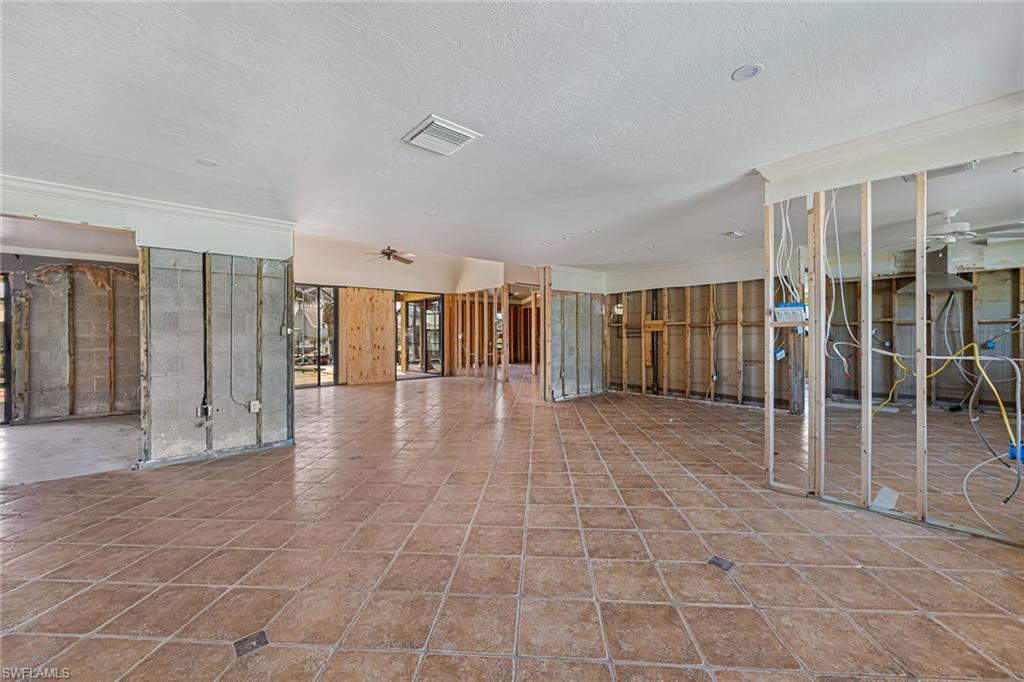 390 Randy Lane Fort Myers Beach, FL 33931 - Photo 3 of 19 a view of a hall with white walls