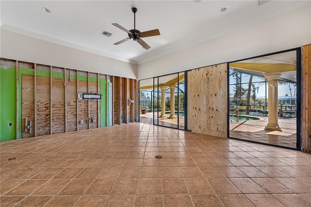 390 Randy Lane Fort Myers Beach, FL 33931 - Photo 4 of 19 a view of an empty room with windows