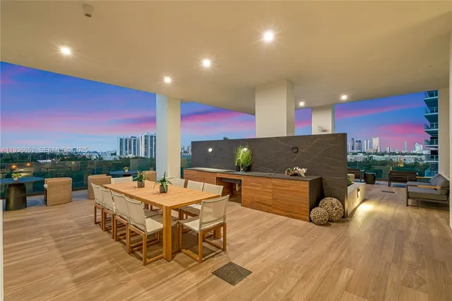 a view of a patio with dining table and chairs