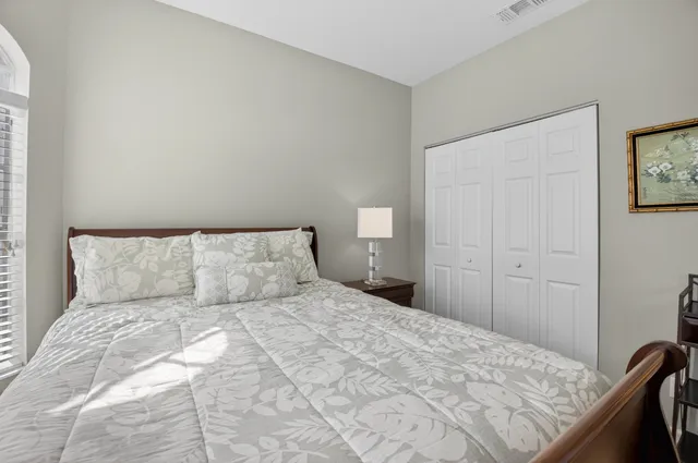 a kitchen with stainless steel appliances granite countertop a sink a stove top oven a chimney and a center island