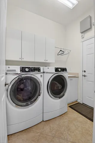 an aerial view of a house with a yard and lake view