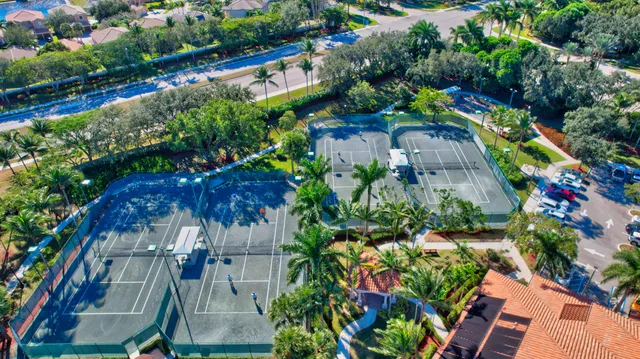 a living room with furniture kitchen view and a large window