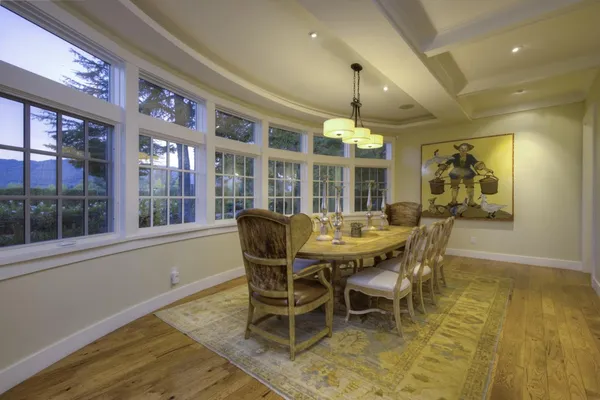 a view of a dining room with furniture window and wooden floor