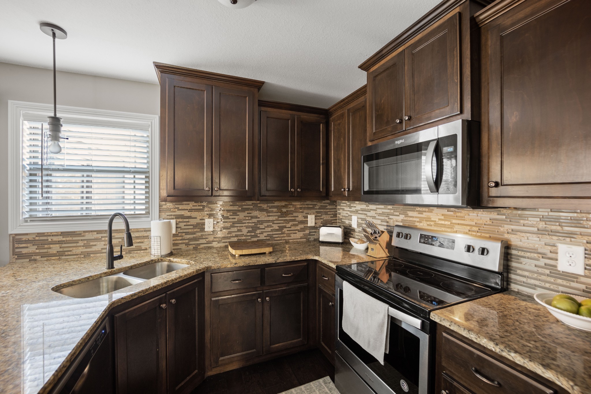 671 Salem Ridge Road Clarksville, TN 37040 - Photo 11 of 42 a kitchen with stainless steel appliances a sink stove and microwave