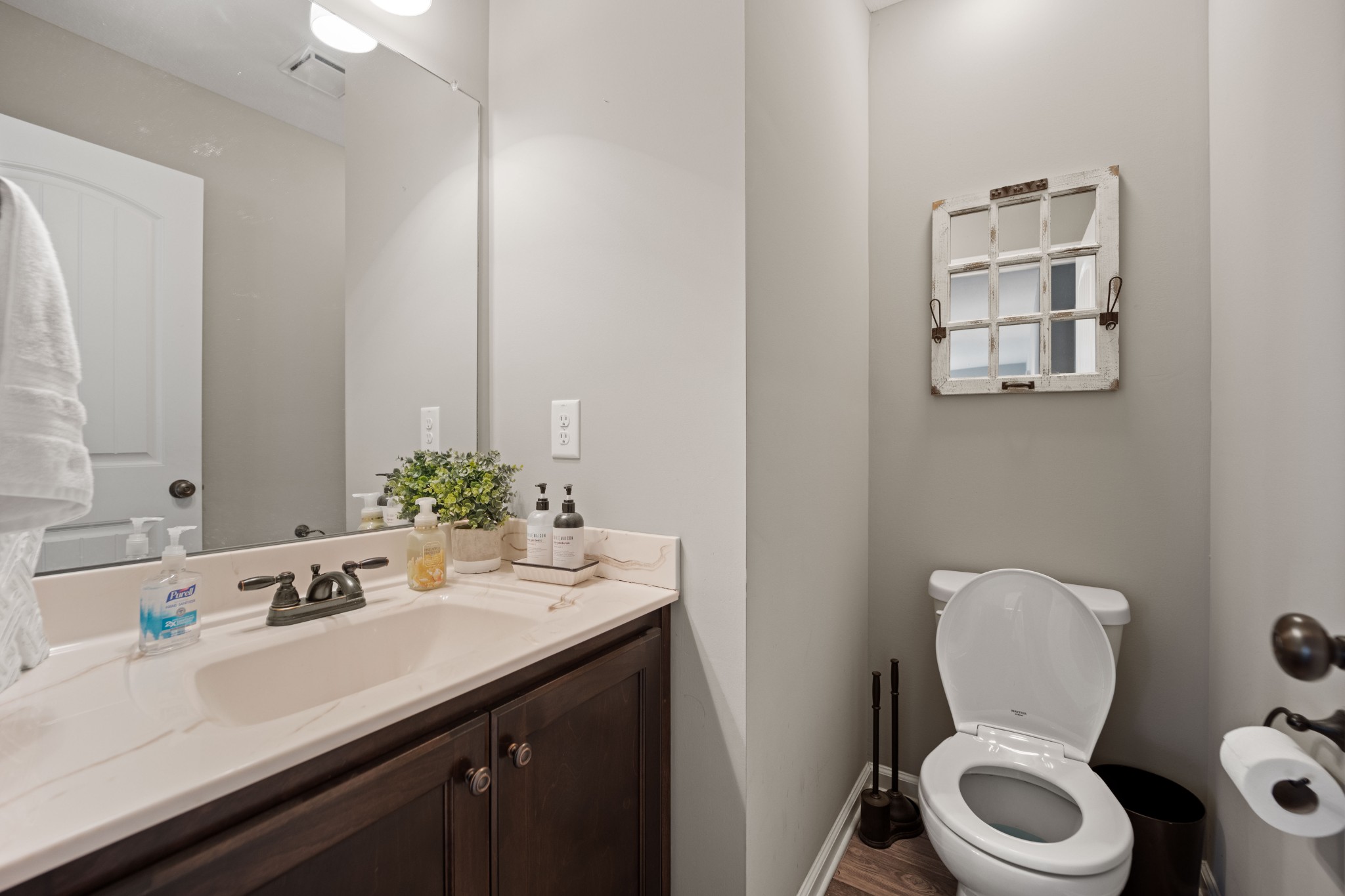 671 Salem Ridge Road Clarksville, TN 37040 - Photo 26 of 42 a bathroom with a toilet sink and mirror