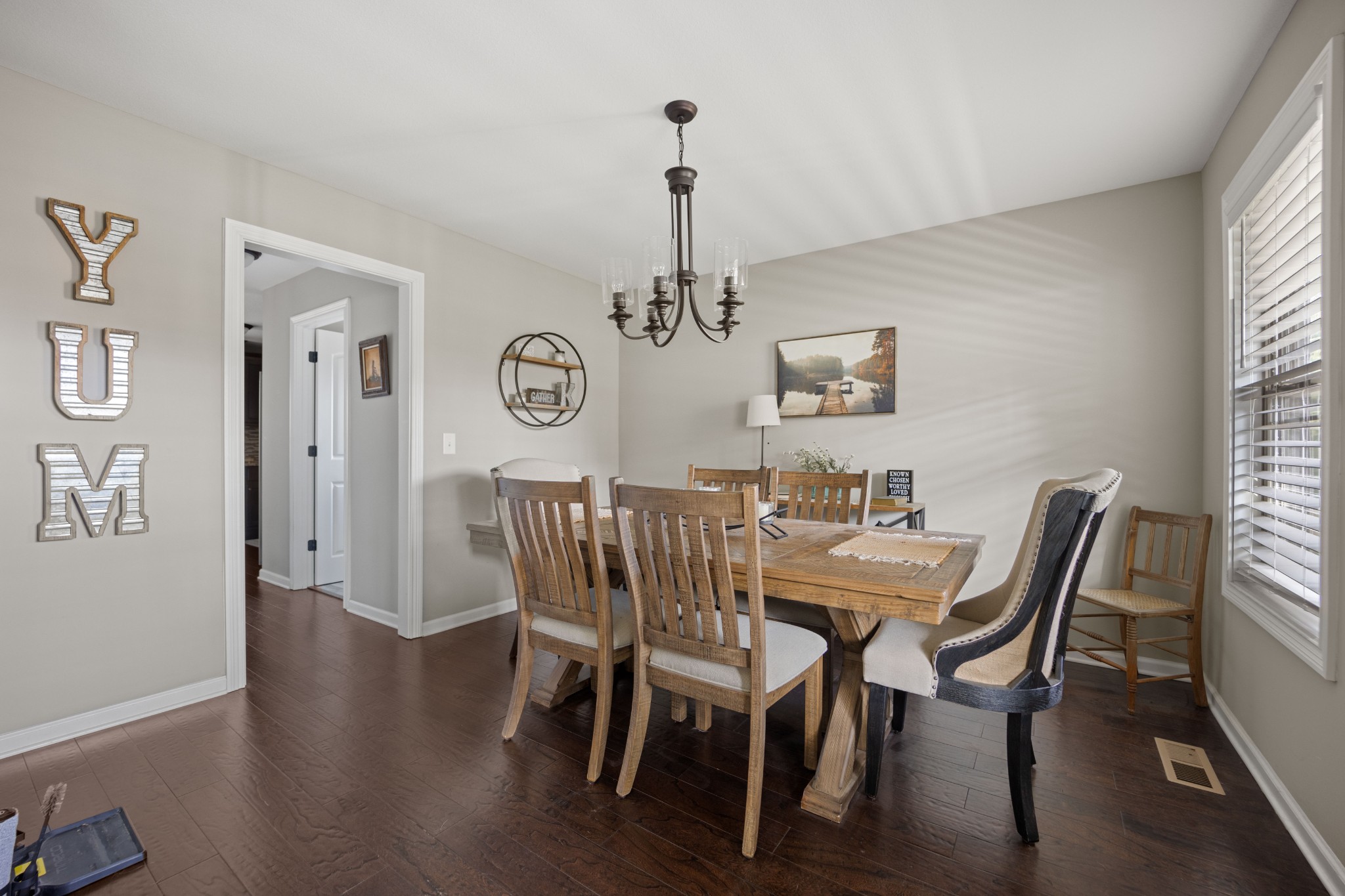 671 Salem Ridge Road Clarksville, TN 37040 - Photo 7 of 42 a view of a dining room with furniture window and wooden floor