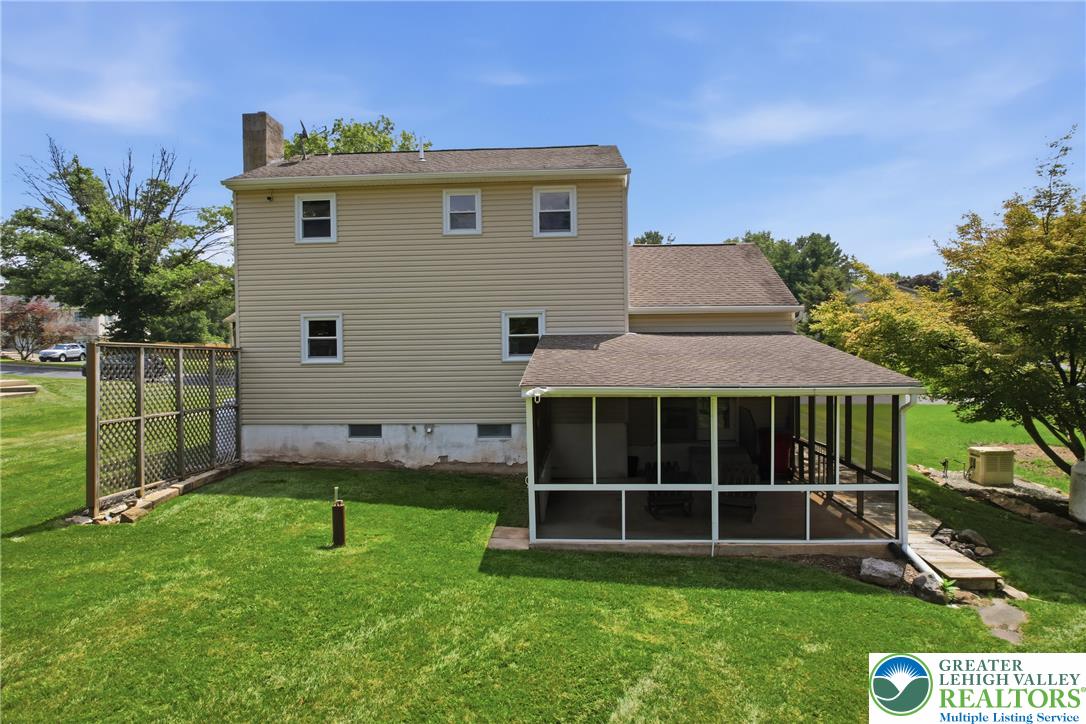 1385 Woodmere Road Pottstown, PA 19464 - Photo 46 of 57 An inviting screened-in porch offers tranquil outdoor living space overlooking a well-kept yard.
