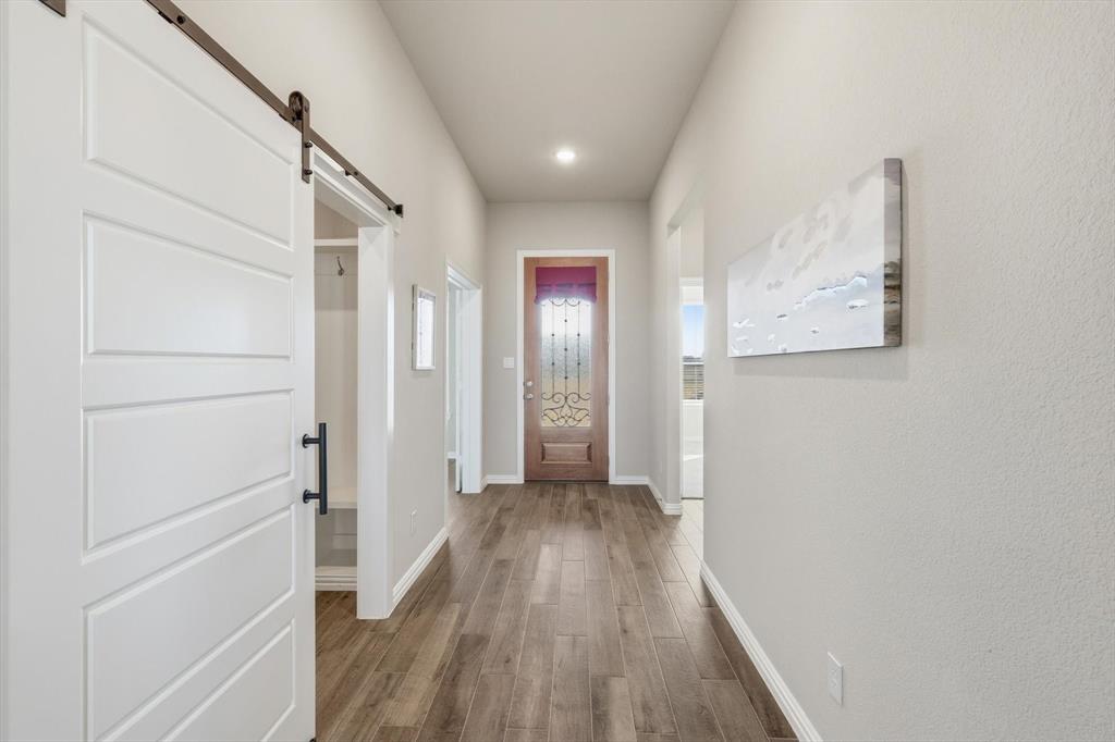 139 Steppes Court Decatur, TX 76234 - Photo 11 of 40 a view of hallway with wooden floor