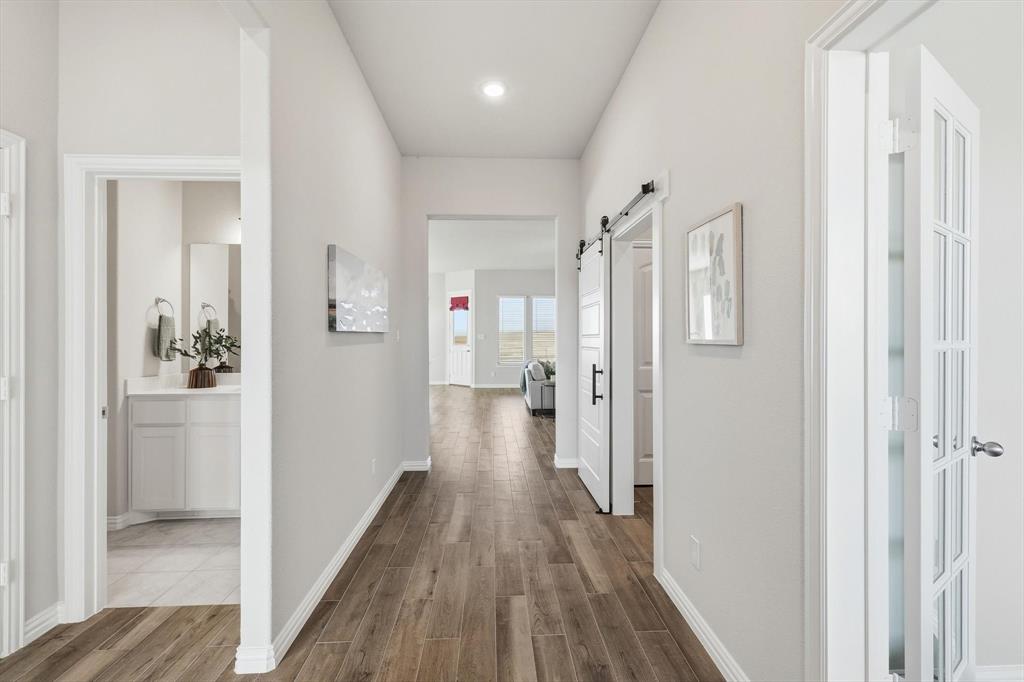 139 Steppes Court Decatur, TX 76234 - Photo 12 of 40 a view of a hallway with wooden floor